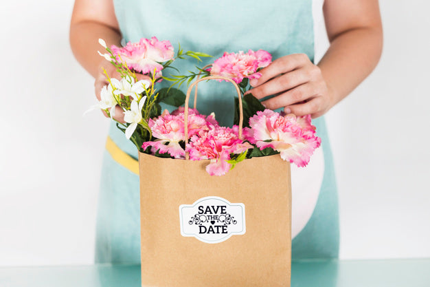 Gardening Concept With Woman Preparing Bag With Flowers Psd