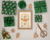Gifts Wrapped In Green Paper Around Painting Psd