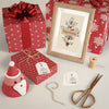 Gifts Wrapped In Red Paper On Table Psd