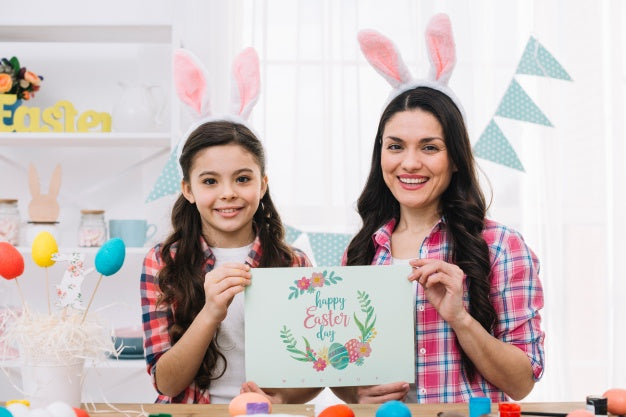 Girl And Mother With Card Mockup On Easter Day Psd