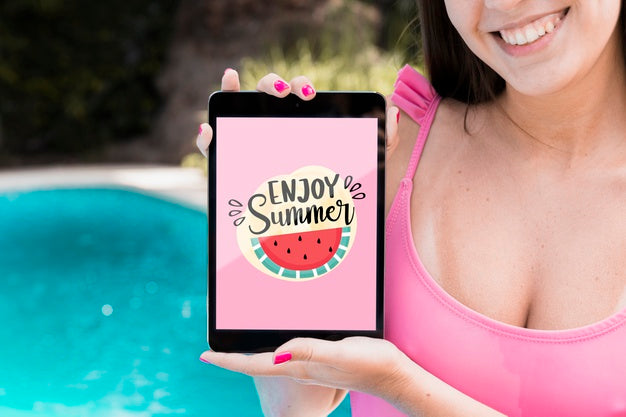 Girl Presenting Tablet Mockup Next To Pool Psd