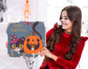 Girl Showing Cute Card With Cat And Carved Pumpkin Psd