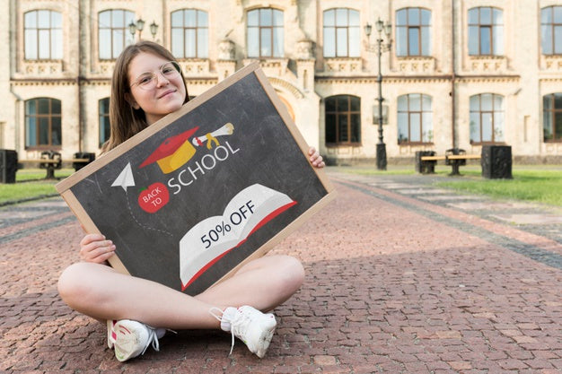 Girl Sitting While Holding A Blackboard Mock-Up Psd