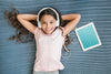 Girl With Headphones Next To Tablet Mockup Psd