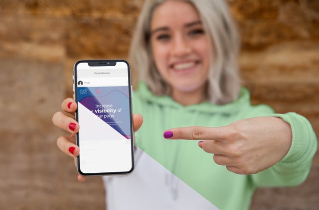 Girl With Hoodie Pointing At Mobile Psd