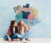 Girls In Front Of A Wall With A Cartoon Mock-Up Psd
