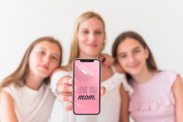 Girls Presenting Smartphone Mockup For Mothers Day Psd