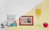 Glass Of Champagne Next To A Frame With Mock-Up Psd