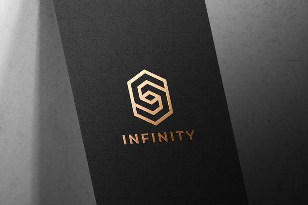 Golden Logo Mockup On Black Paper Psd