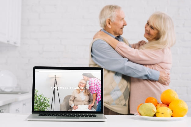 Grandparents Behind Laptop Mockup Psd