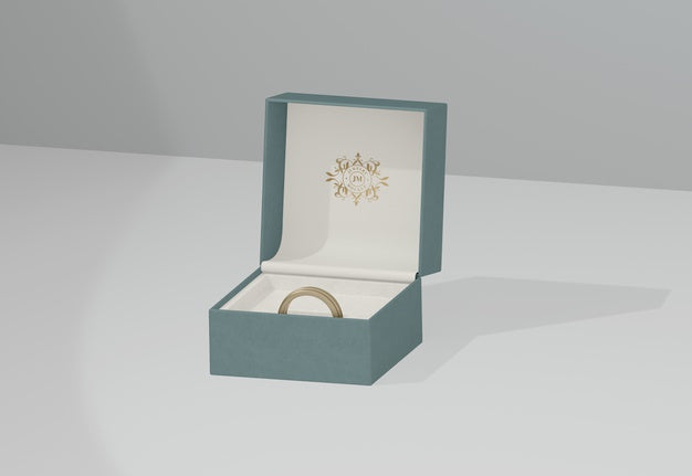 Green Jewelry Box With Golden Wedding Ring Psd