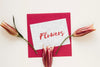 Greeting Card With Blooming Flowers On Table Psd