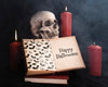 Halloween Concept With Skull Candles And Book Psd
