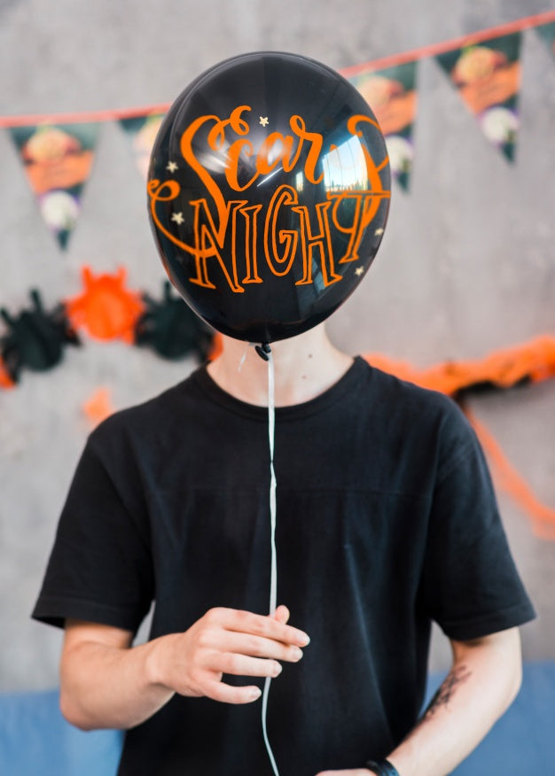 Halloween Mockup With Man Holding Balloon Psd