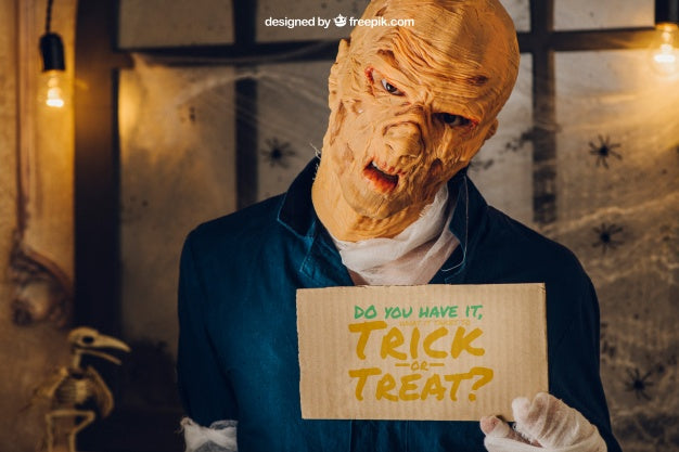 Halloween Mockup With Monster Showing Cardboard Psd