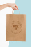 Hand Holding A Paper Bag Mock-Up Psd