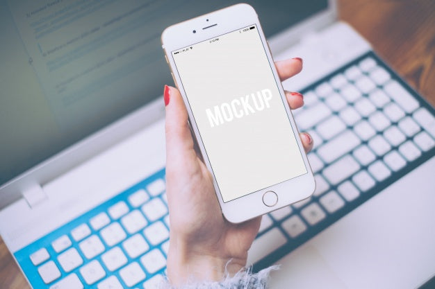 Hand Holding A Smartphone On Keyboard Mock Up Psd