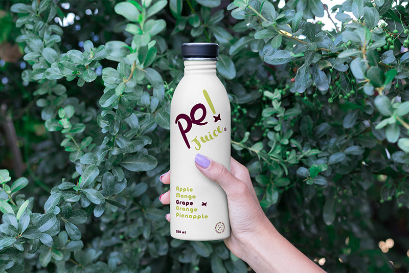 Hand Holding Bottle Mockup