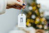 Hand Holding Christmas Tag Template Psd
