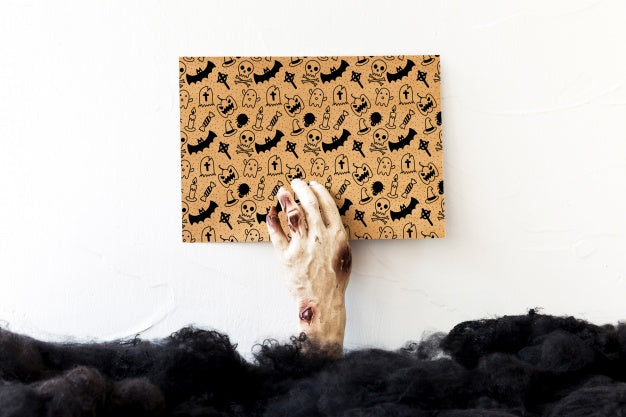 Hand Holding Cover With Halloween Concept Psd