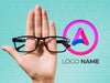 Hand Holding Glasses And Logo Name Design Psd