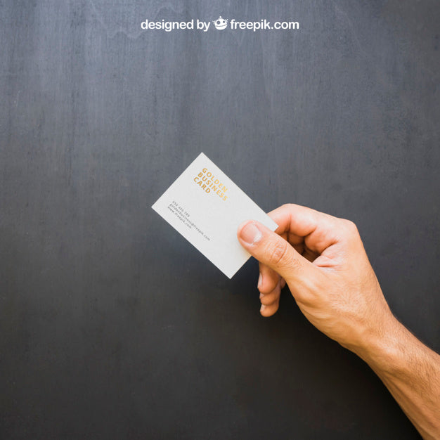 Hand Holding Golden Business Card Psd
