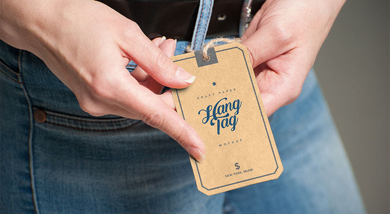 Hand Holding Kraft Paper Hang Tag Mockup Psd