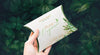 Hand Holding Pillow Packaging Box Mockup Psd