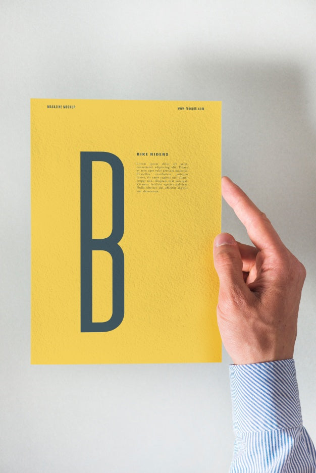 Hand Holding Yellow Paper Mockup Psd