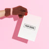 Hand Wearing Glove Holding A Paper Mockup Psd
