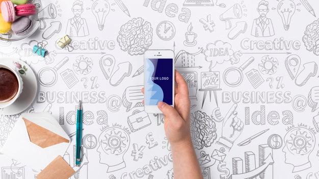 Hand With Mobile Desk Concept With Tools Psd