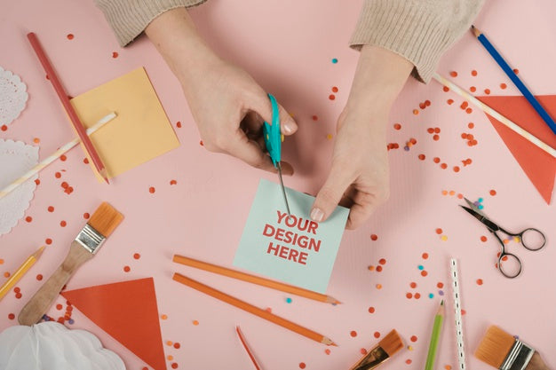 Hands Cutting A Card With Your Design Logo Psd