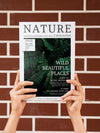 Hands Holding A Nature Magazine Mock Up Psd