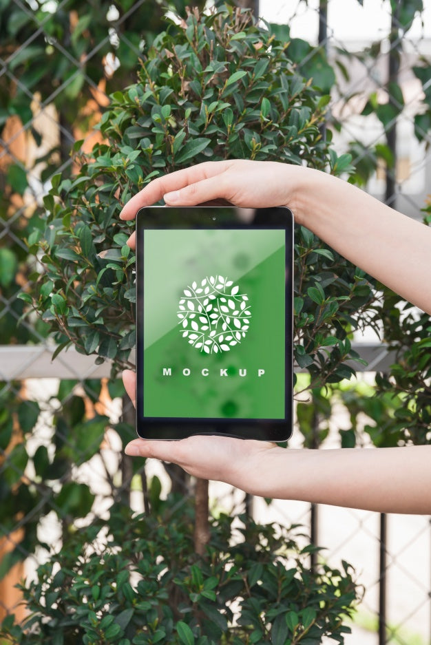 Hands Holding Tablet Mockup With Gardening Concept Psd