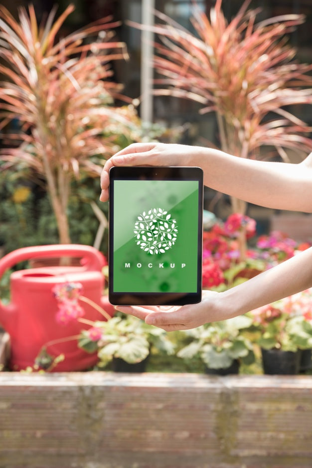 Hands Holding Tablet Mockup With Gardening Concept Psd
