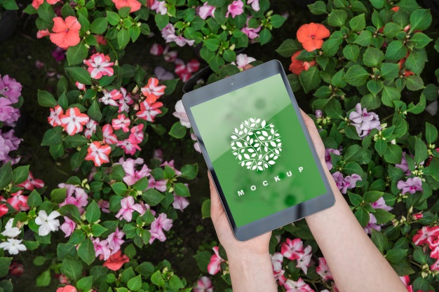 Hands Holding Tablet Mockup With Gardening Concept Psd