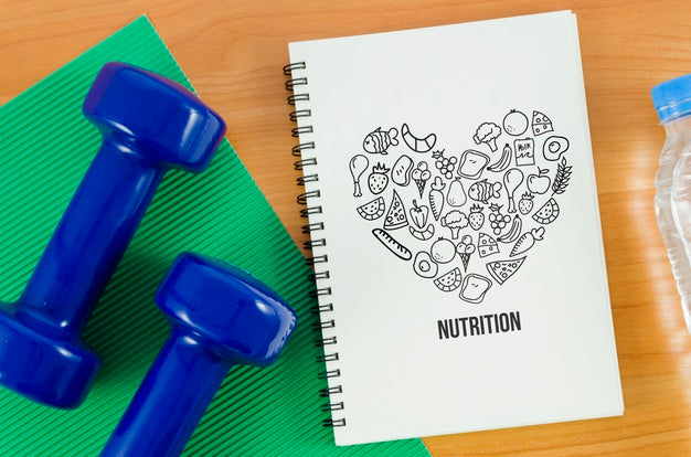 Hands Weights Beside Notebook Psd