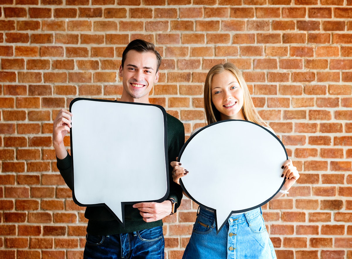 Happy Cute Young Couple Holding An Empty Placard Thought Bubble Copyspace