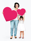 Happy Family Holding Heart Shaped Icons