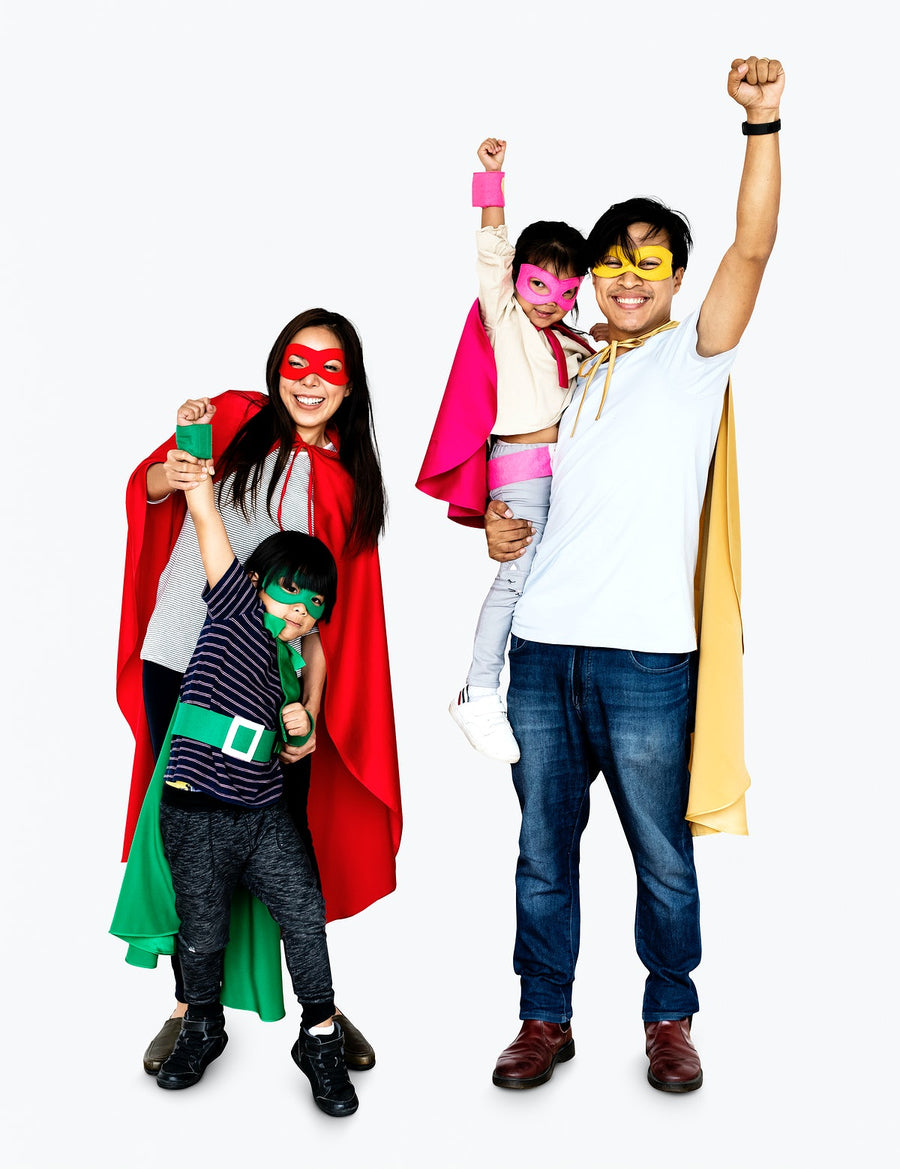Happy Family Wearing Superhero Costumes