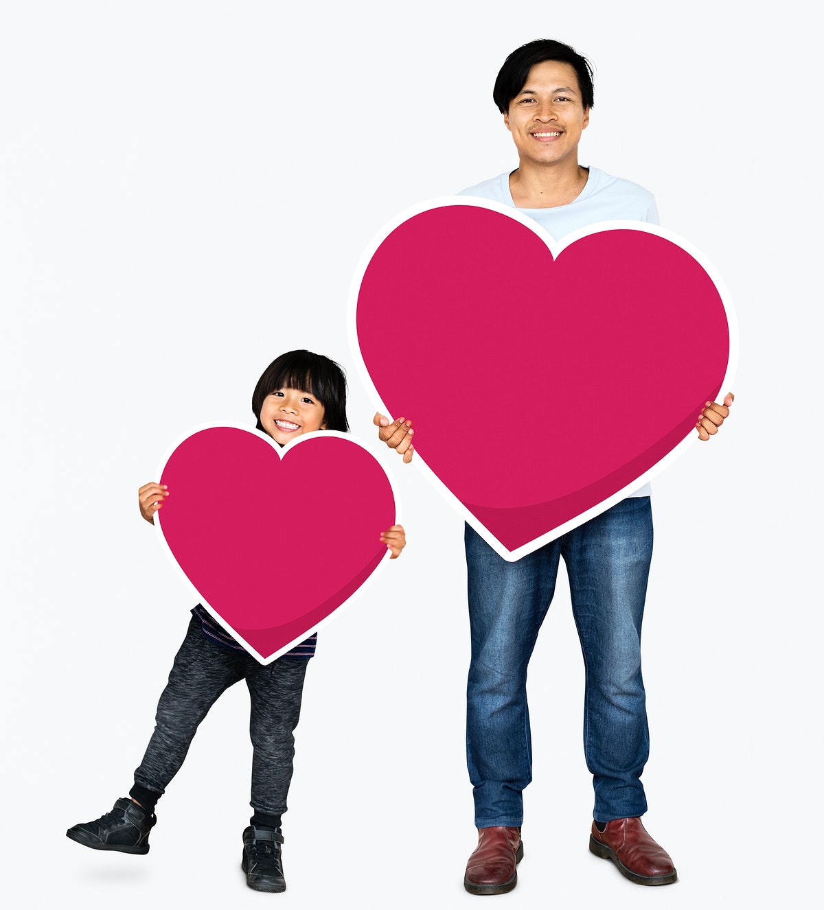 Happy Father And Son Holding Hearts