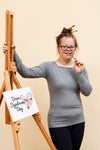 Happy Girl With Down Syndrome Posing With Canvas Mock-Up Psd
