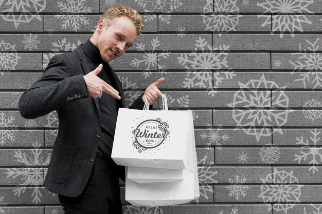 Happy Male Pointing At His Shopping Bags Psd