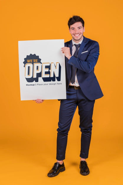 Happy Man Holding A Placard Concept Mock-Up Psd