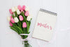 Happy Mother'S Day Mock Up On Notebook With Pink And White Tulips, On White Wooden Background Psd