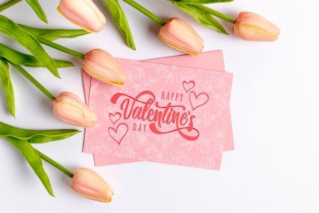 Happy Valentines Day Lettering On Pink Card Next To Tulips Psd