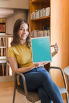 Happy Woman Holding Tablet Mockup In Library Psd