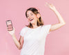 Happy Young Woman With Headphones Holding A Cellphone Mock-Up Psd