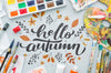 Hello Autumn Message With Acrylic Pallette And Brushes Psd
