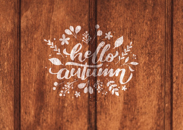 Hello Autumn Written On A Wooden Background Psd